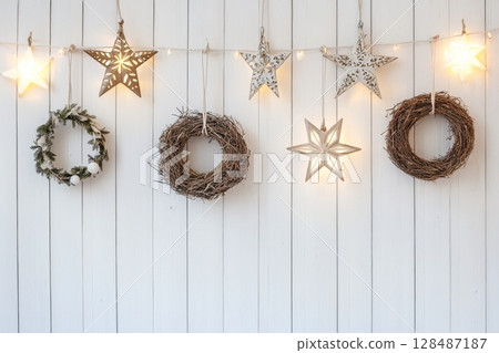 Christmas Paper Star, Wreath with Fir Branches Decoration. Handmade Christmas Nordic Decor Hanging Against White Wall Background. Boho, Scandinavian Style Design. DIY. Minimal Ornament. Zero Waste 128487187