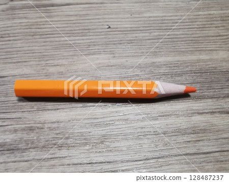pencil on wood background 128487237