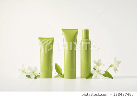 Blank cream tube, jar package plastic set. Pale mint green colors. Skin care luxurious portable on white background, soft shadow. Eco cosmetic containers, flowers. Beauty product modern packaging. 128487493