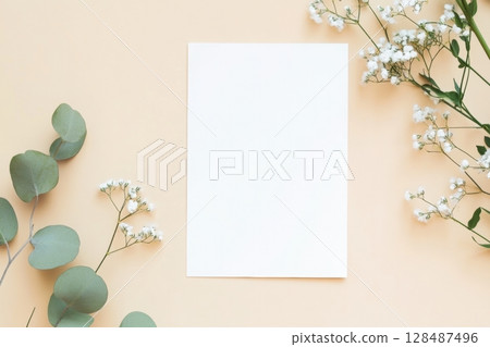 Blank greeting card, invitation mockup. Eucalyptus branch plant on wooden table background. Flat lay, top view. Copy space. Paper sheet mock up. Modern Minimal business brand template. Soft shadow. A4 128487496