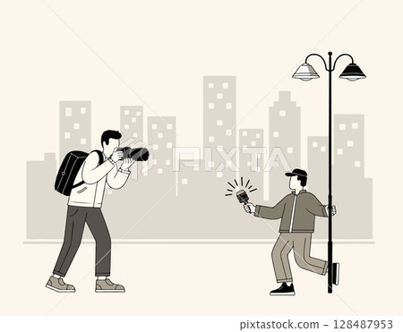 Photographer and Interviewer in Cityscape 128487953