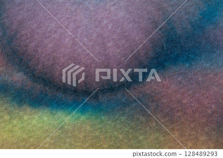Ink blending on textured surface creates an abstract composition of colors and shapes Ink blending on textured surface creates an abstract composition of colors and shapes 128489293