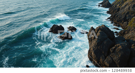 Abstract Ocean Current Aerial perspective of ocean currents creating swirling patterns of different water densities visible through color variations from Abstract Ocean Current Aerial perspective of ocean currents creating swirling patterns of different water densities visible through color variations from 128489938