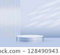 Minimalist light blue cosmetic product mockup scene with a round glass podium and soft natural shadows 128490943