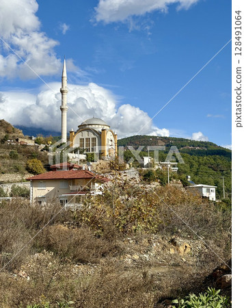 mosque in mountains autumn countryside grass. High quality photo 128491064