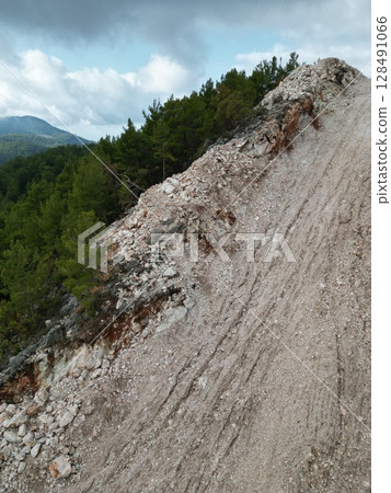 metal pipes lay gas in the mountains. High quality photo metal pipes lay gas in the mountains. High quality photo 128491066
