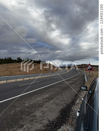 Cloudy road landscape. High quality photo 128491100