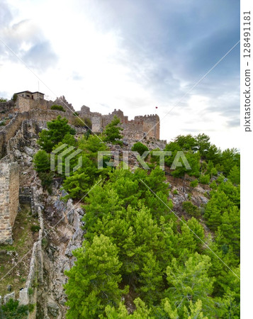 Rocky cliff castle Tower seaside ruins Ancient stone ruins. High quality photo Rocky cliff castle Tower seaside ruins Ancient stone ruins. High quality photo 128491181