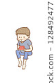 Boy eating watermelon and trying to pop the seeds out with his mouth 128492477