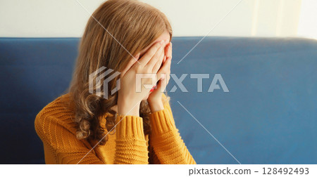Upset sad crying woman while experiencing mental suffering, depression, fatigue, emotional stress Upset sad crying woman while experiencing mental suffering, depression, fatigue, emotional stress 128492493