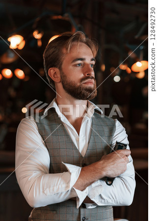 Handsome barber is in the salon 128492730