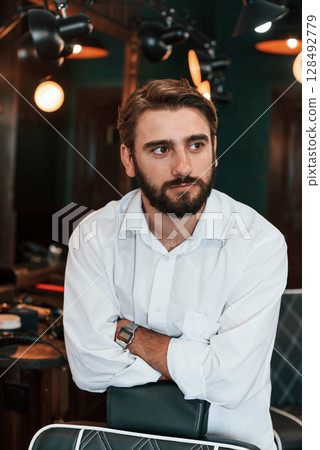 Handsome man with beard is in the barber shop Handsome man with beard is in the barber shop 128492779