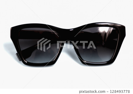 Black sunglasses on white background 128493778