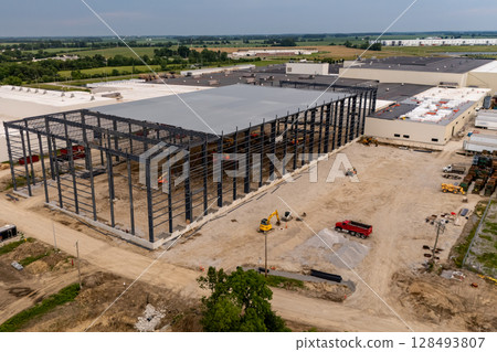 New building construction at former industrial complex site. New building construction at former industrial complex site. 128493807