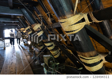 Tourists touring the traditional structure in the attic of the Nagase family home in Shirakawa-go 128494311
