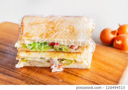 Crabstick salad hot sandwich Crabstick salad hot sandwich 128494513