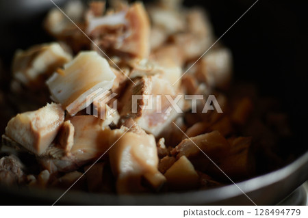 Boil the pork in a hot pot Boil the pork in a hot pot 128494779