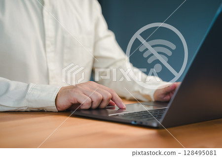 Male person using a laptop computer to connect to wifi, representing internet connectivity issues, network failure, offline mode, or technology disruption. Male person using a laptop computer to connect to wifi, representing internet connectivity issues, network failure, offline mode, or technology disruption. 128495081