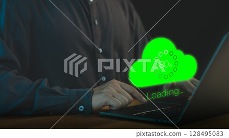 Person using a laptop computer with a glowing green cloud upload icon and loading progress bar, representing cloud computing, data transfer, internet of things, and digital technology. Person using a laptop computer with a glowing green cloud upload icon and loading progress bar, representing cloud computing, data transfer, internet of things, and digital technology. 128495083