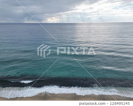 Sunset ocean waves. Sunset ocean horizon. High quality 4k footage 128495245