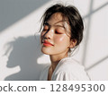 Natural beauty portrait of a smiling young woman with glowing skin 128495300