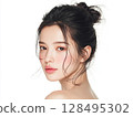 Beauty portrait of a young woman with clean, beautiful skin and updo 128495302