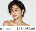Beauty portrait of a young woman with wet short hair and lustrous skin 128495306