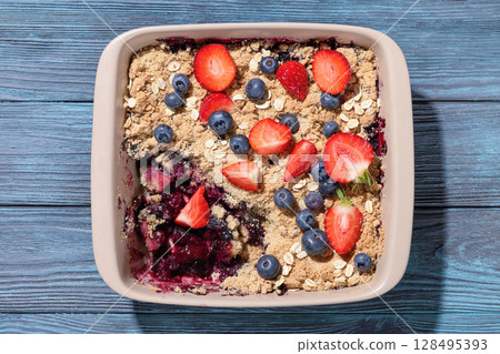 apple blueberry strawberry crumble in baking dish apple blueberry strawberry crumble in baking dish 128495393