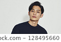 Upper body of a young man in a sweater photographed against a white background | A trusting expression 128495660