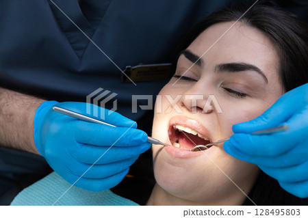 A Dental Check-Up: The Importance of Regular Oral Health Monitoring to Ensure Healthy Teeth and Gums in a Professional Setting 128495803