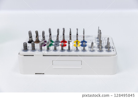 A Compact Dental Drill Bit Kit Displaying Various Types of Precision Instruments in an Organized Arrangement for Dental Professionals to Utilize in Their Practice 128495845