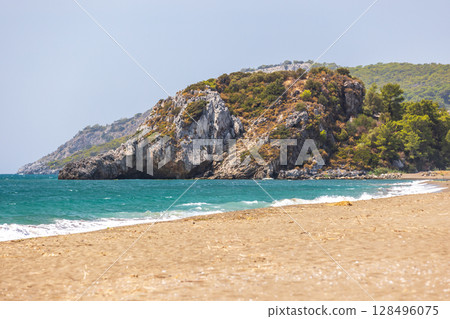 A breathtaking view of Sarigerme beach with sandy shore. Turkey A breathtaking view of Sarigerme beach with sandy shore. Turkey 128496075