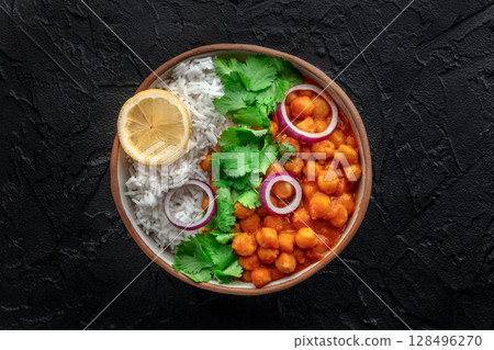 Chana masala, chickpea curry, traditional Indian dish, overhead flat lay shot 128496270