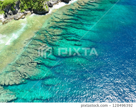 Aerial shot of the northern tip of Okinawa, near Cape Hedo, taken by drone 128496392