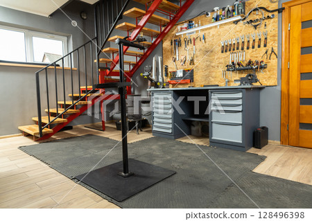 Mechanic workshop contains professional tools for bicycle repair Mechanic workshop contains professional tools for bicycle repair 128496398