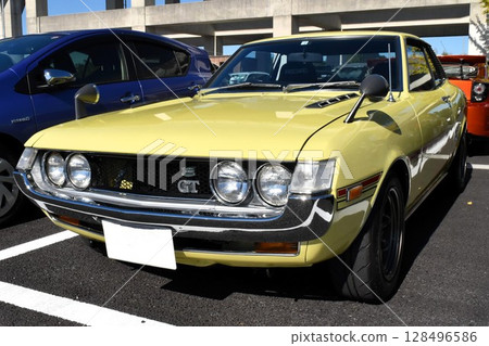 Cars lined up in a parking lot (first generation Toyota Celica) Cars lined up in a parking lot (first generation Toyota Celica) 128496586
