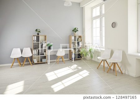 Empty modern office workplace with wooden table, boardroom with desk, chairs for group briefing Empty modern office workplace with wooden table, boardroom with desk, chairs for group briefing 128497165