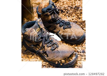 Old and torn boots on a transparent background. High quality photo Old and torn boots on a transparent background. High quality photo 128497282