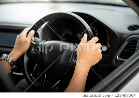 Focused Driving. Hands gripping the steering wheel of a car. Focused Driving. Hands gripping the steering wheel of a car. 128497364