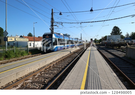 Austria: Suburban station and tram 128498005