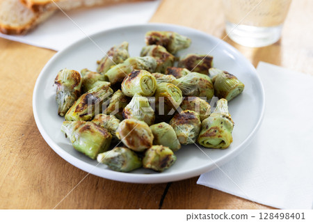 fried artichoke hearts on a plate 128498401