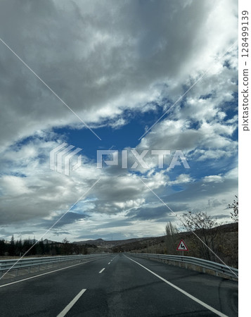Cloudy road landscape. High quality photo 128499139