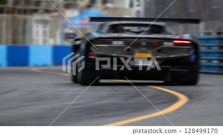 Motion blur race car racing on speed track, Motion blurred super car race on street track circuit, Automobile automotive transportation vehicle background, Motion blur race car racing on speed track, Motion blurred super car race on street track circuit, Automobile automotive transportation vehicle background, 128499170