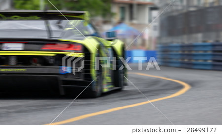 Motion blur race car racing on speed track, Motion blurred super car race on street track circuit, Automobile automotive transportation vehicle background, 128499172