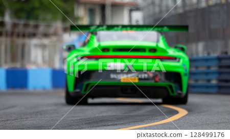 Motion blur race car racing on speed track, Motion blurred super car race on street track circuit, Automobile automotive transportation vehicle background, Motion blur race car racing on speed track, Motion blurred super car race on street track circuit, Automobile automotive transportation vehicle background, 128499176