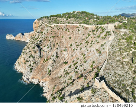 fortress on a rock near the sea coast 128499210