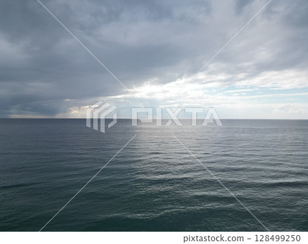 Sunset ocean waves. Sunset ocean horizon. High quality 4k footage 128499250