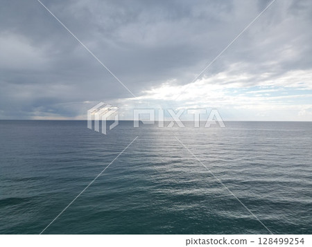 Sunset ocean waves. Sunset ocean horizon. High quality 4k footage 128499254
