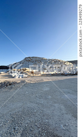 Marble quarry sunlight. white large blocks in the rays of sunset.High quality photo 128499279
