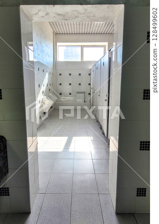 Toilet with bright sunlight from the window 128499602